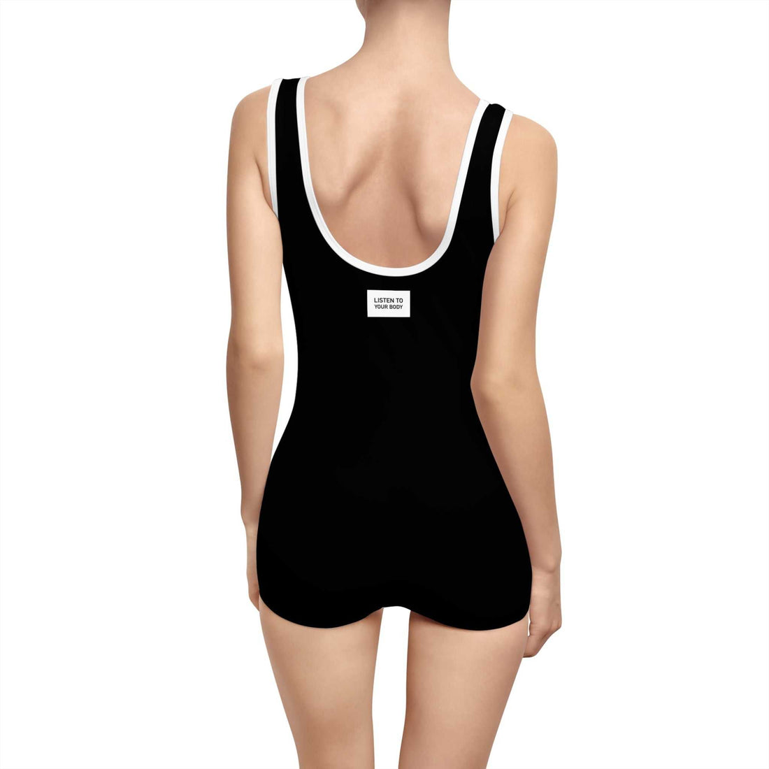 Back view of vintage style black Listen To Your Body Onesie with deep U-shape neck and elastic straps on woman